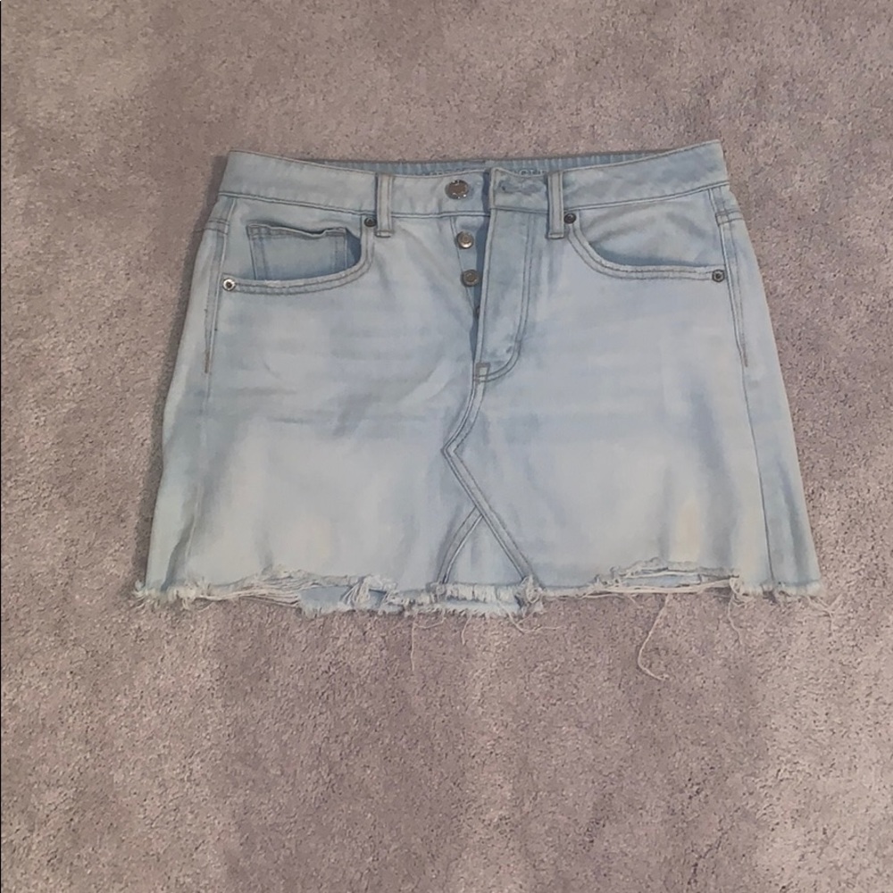 Light wash distressed denim skirt